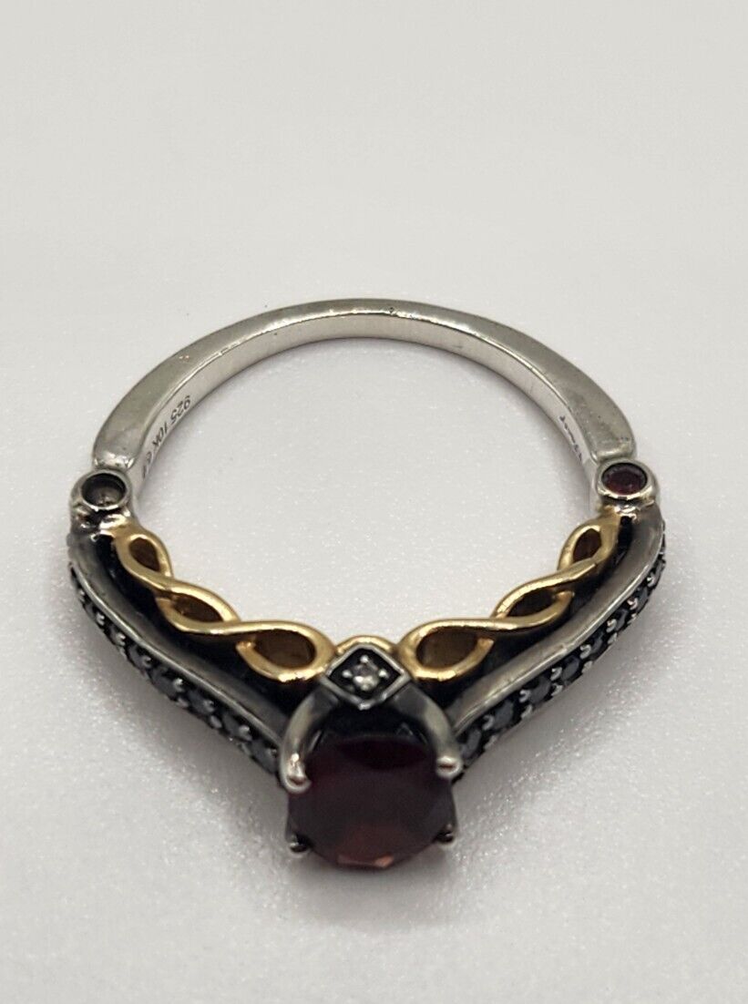 Oval Garnet and 1/4 CT. T.W. Diamond Ring in 2 Tone Sterling Silver and 10K Gold